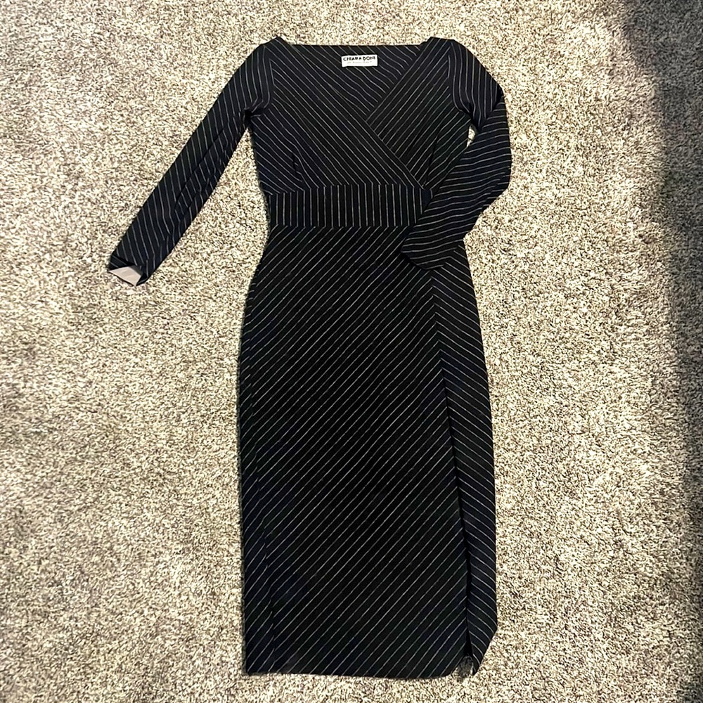 Gorgeous, designer bodycon style dress. The fabric is amazing!! Worn 1x